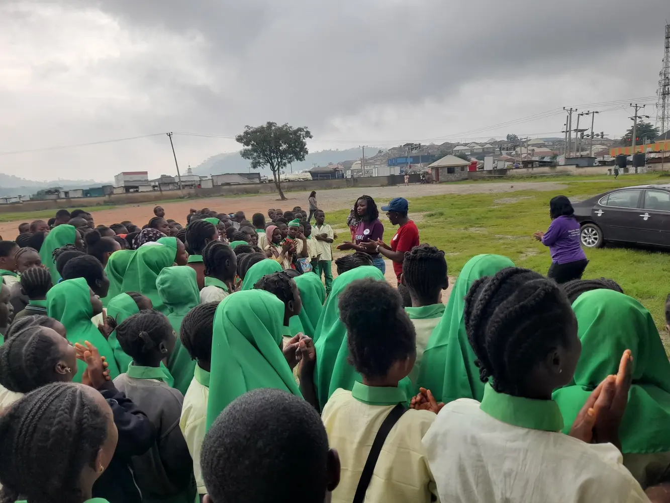 Students listening during a community learning session