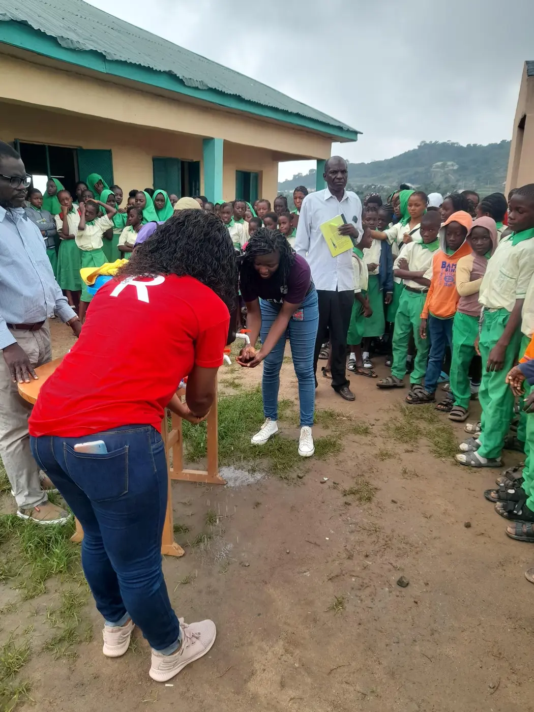 A WEMAI volunteer leading an outdoor activity
